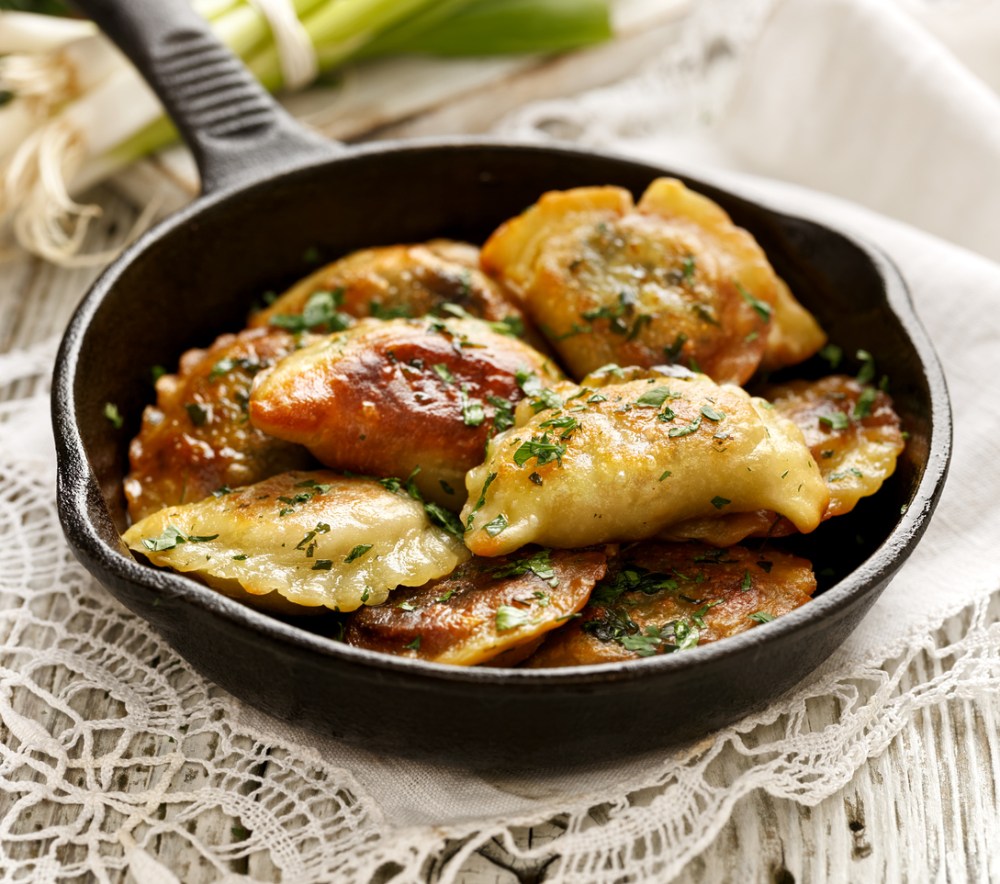 Baked dumplings on a cast-iron frying pan